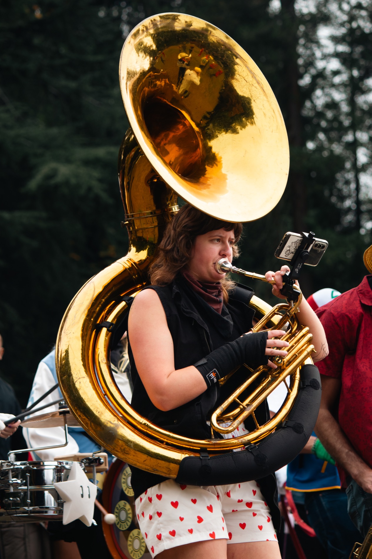 A sousaphone player performing with a marching band at Volunteer Park